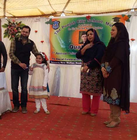 Prize winners on stage with their families