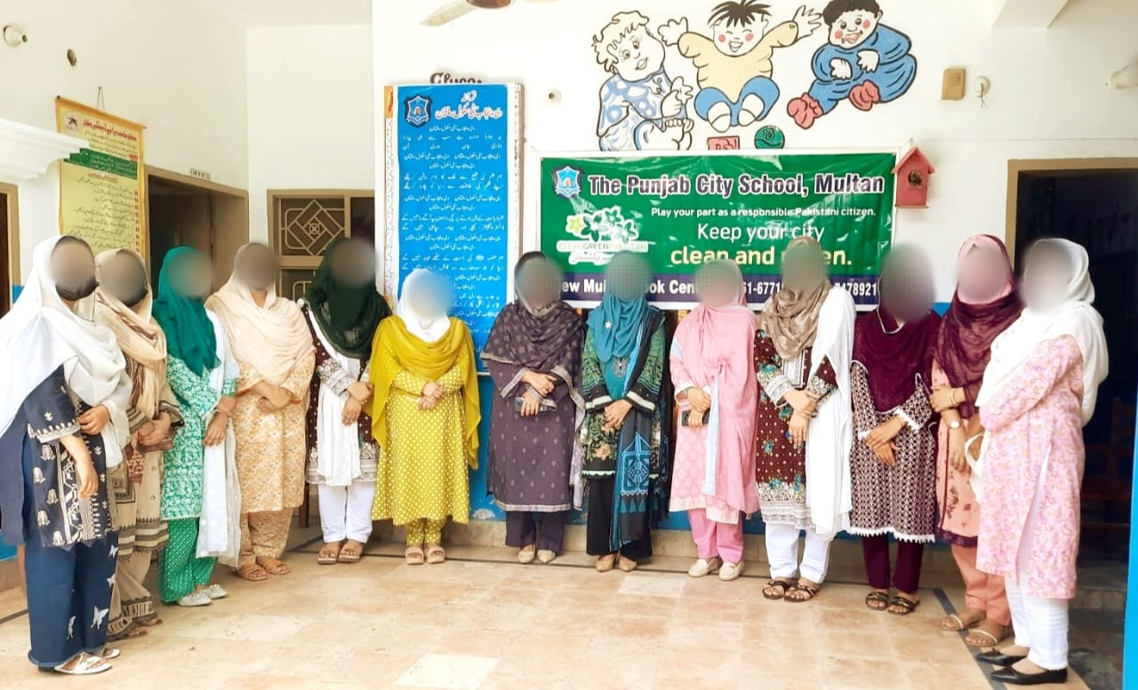 Staff supporting the Clean and Green Pakistan campaign