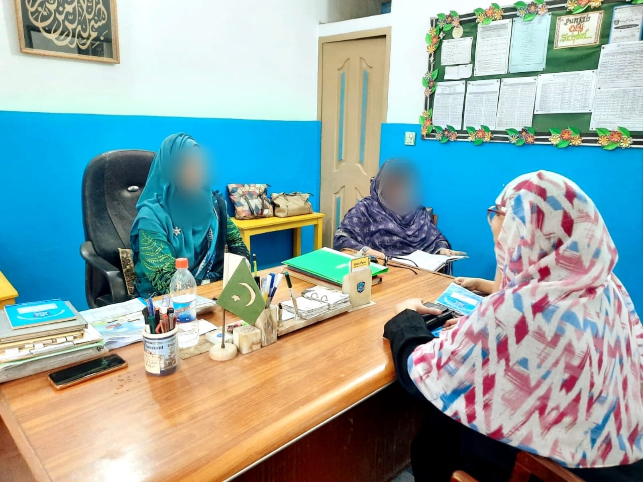 Parent-teacher meeting in the school office