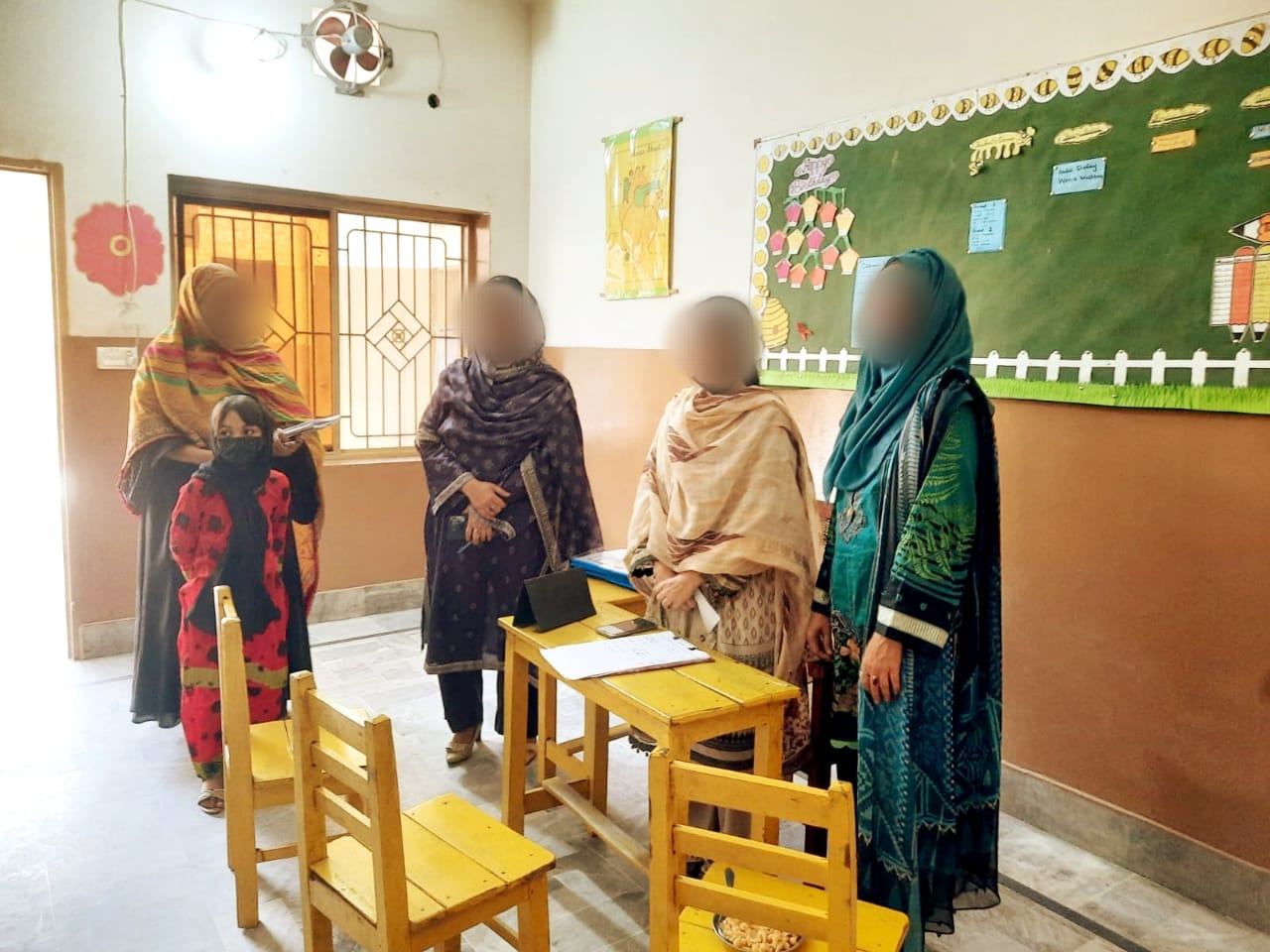 Teachers preparing class materials for parents
